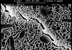In a conventional ceramic, cracks quickly eat through the atomic crystal lattice and then jump over to the neighboring crystallite.