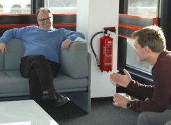 Ali discussing progress with his PhD students over a coffee.