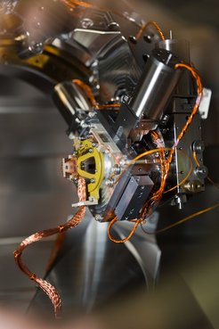 Picture of the 4-circle in vacuum goniometer in the main chamber of the ERIXS spectrometer at the ID32 beamline of the ESRF - the European Synchrotron. This unique goniometer enables both cryogenic cooling and precise manipulation of samples in ultrahigh vacuum, making experiments possible even on our single crystals smaller than 500 μm.